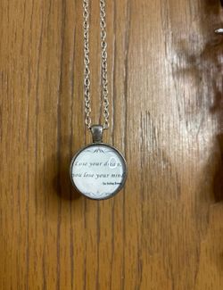 A necklace that says lose your dream, you lose your mind