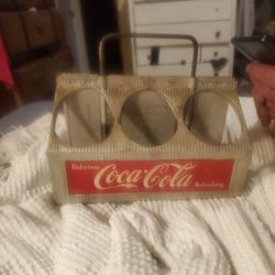 A vintage aluminum Coca-Cola 6 pack bottle Carrier with extended handle real good conditionA vintage aluminum Coca-Cola 6 pack bottle Carrier with ext