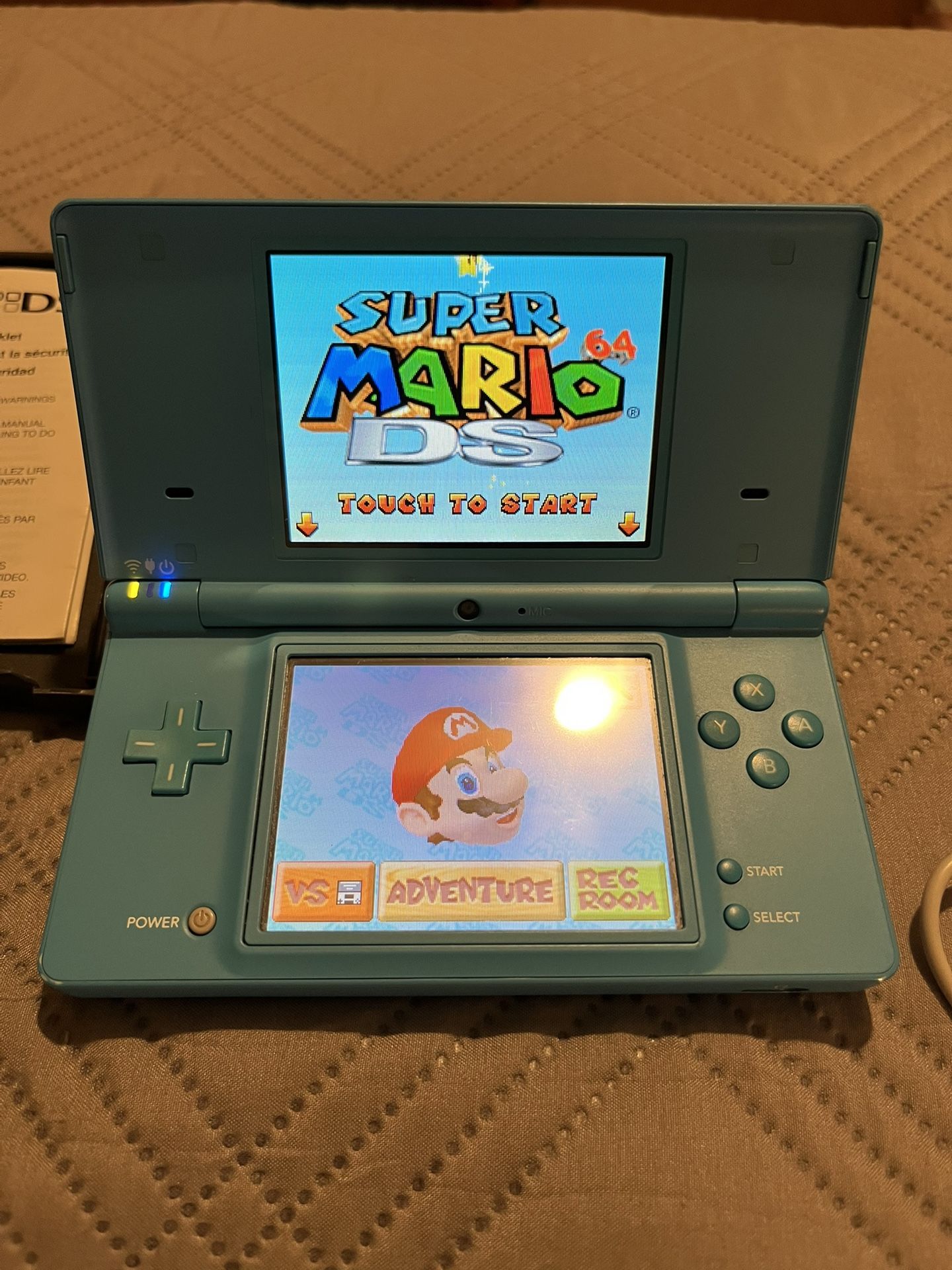 Nintendo DSi Light Blue + Mario And Narnia Game’s (will Trade For Earbuds)