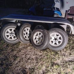 Set Of 5 Trailer Tires And Fender Wells