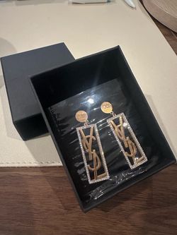 Brand new gold-tone statement earrings.