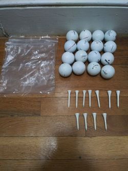 16 White Golf Balls And 11 White Tees