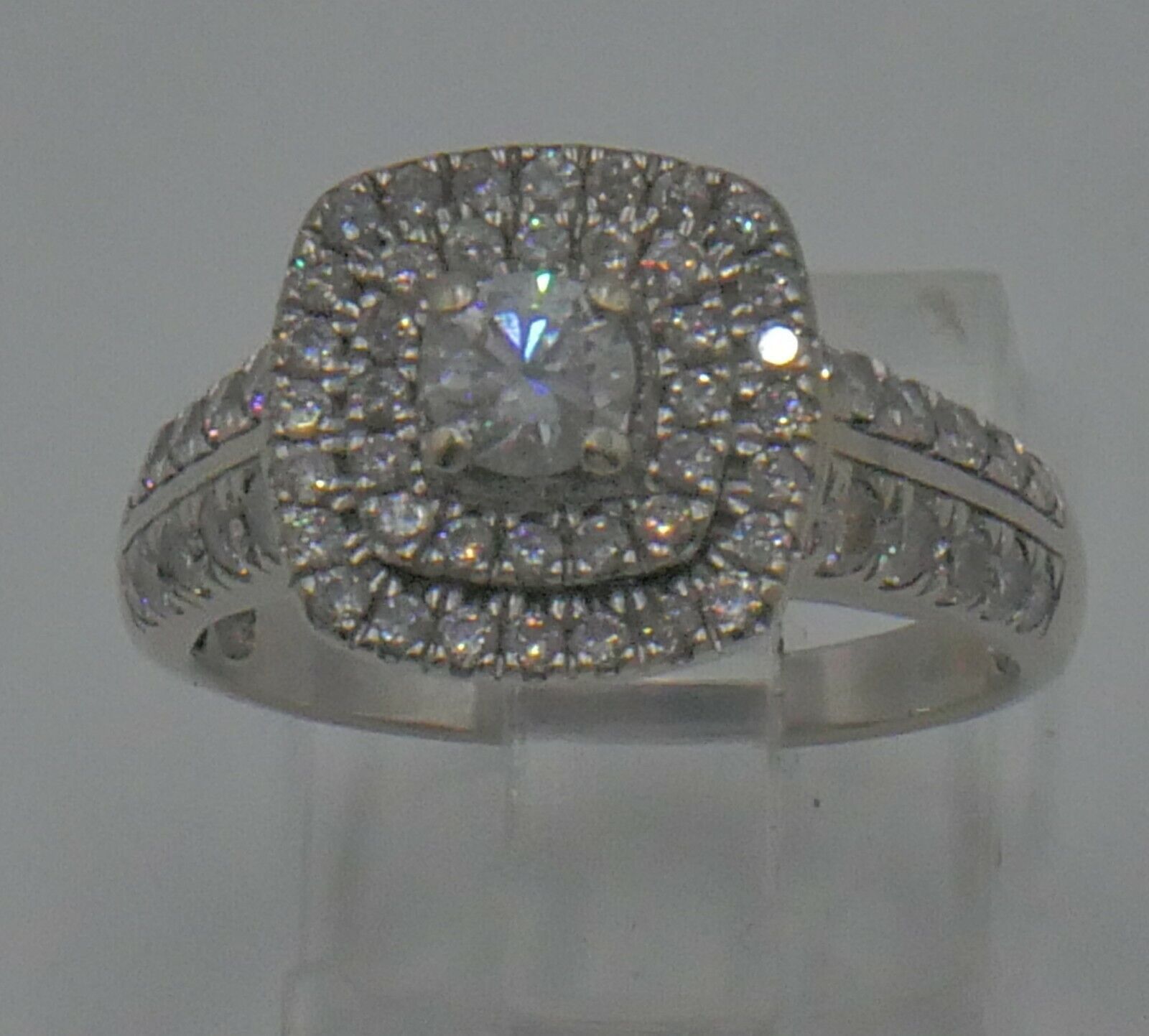10kt white gold engagement ring 5 grams ,size 8, with main round diamond 0.30pts; 60 small round diamonds 0.70pts . 1 carat total approximately. 86241