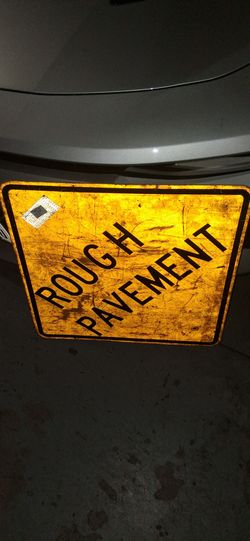 Rough Pavement Street Sign