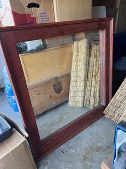 Large mirror with a wooden frame 