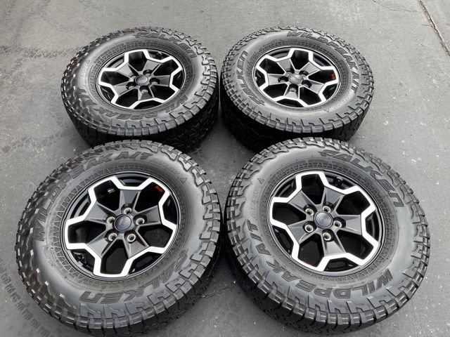 (4) 17” Jeep Gladiator Wheels 285/70R17 Falken Wildpeak - $825