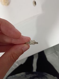 Princess-cut cluster design.
Promise ring/engagement ring
