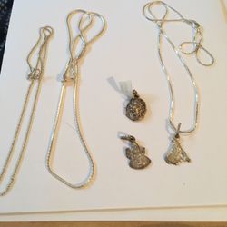 JEWELLERY - SILVER CHAINS WITH PENDANTS . NEW 