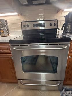 GE Stainless Steel Electric Range with Glass Cooktop and microwave