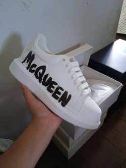 Mqeens white with black writing
