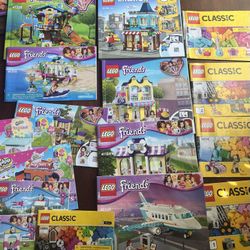 Multiple Lego Sets With Bases And Books