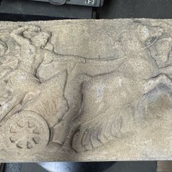 Concrete bas-relief representing “Eos driving his chariot”