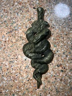 Jade snake on sword sculpture