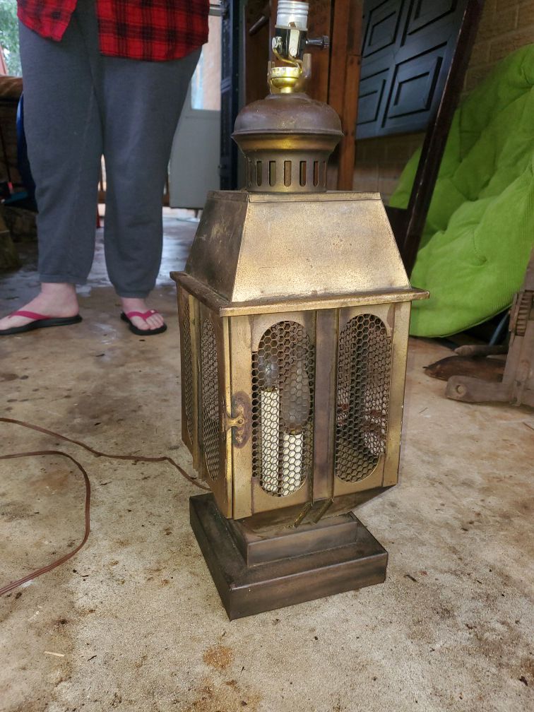 Antique lantern made into modern table lamp. Lights internally and from the top!
