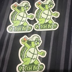 Three Dutch Bros Coffee Stickers March 4 2026 Green Skateboard Turtle