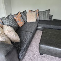 Charcoal Gray Sectional Sofa with Ottoman & Pillows – Fair Condition
