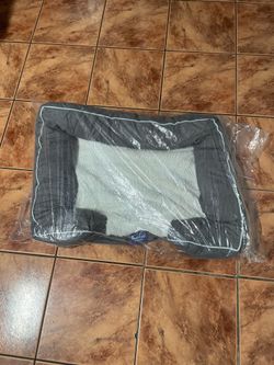 LaiFug dog bed around 2 feet by 2 feet .