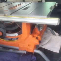 Ridgid Table Saw With Stand That Folds Into Wheeled Cart