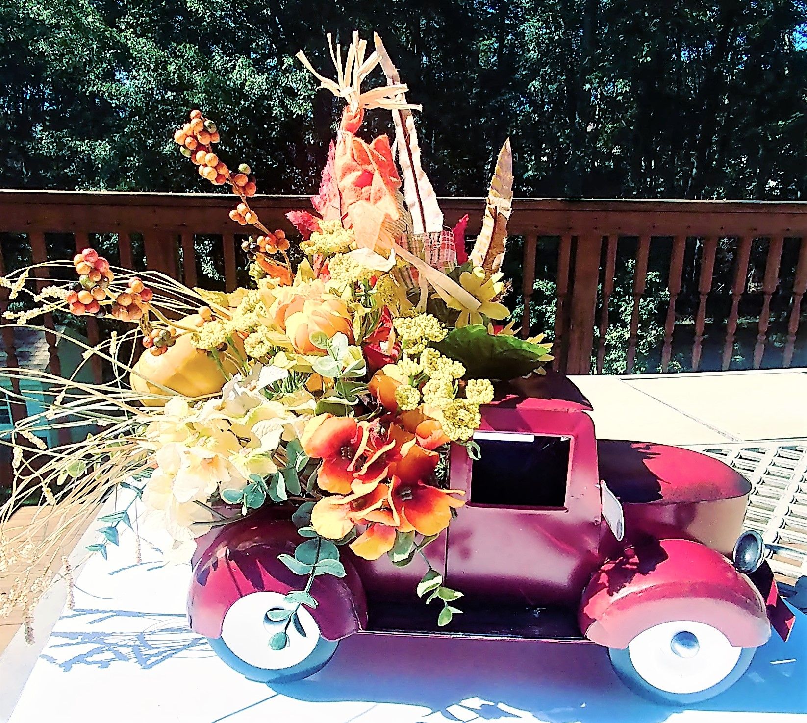 Red farm truck faux flower arrangement