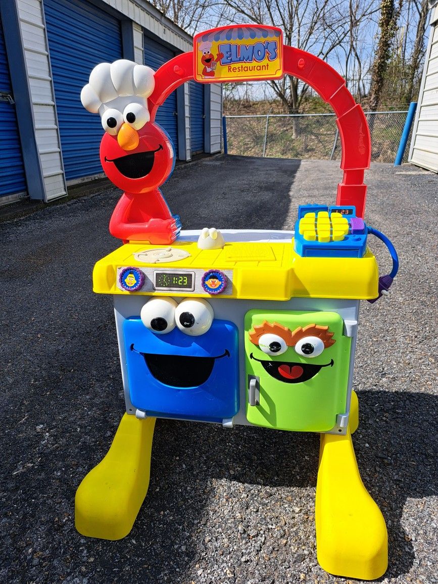 Elmos restaurant 2007 rare fisher price toy sesame street kitchen and 1992 playskool shopping cart with over 90 Pieces Of Food