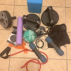 collection of home fitness equipment designed for versatile strength and cardio workouts.