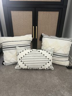 A Set Of Black-And-White Accent Pillows