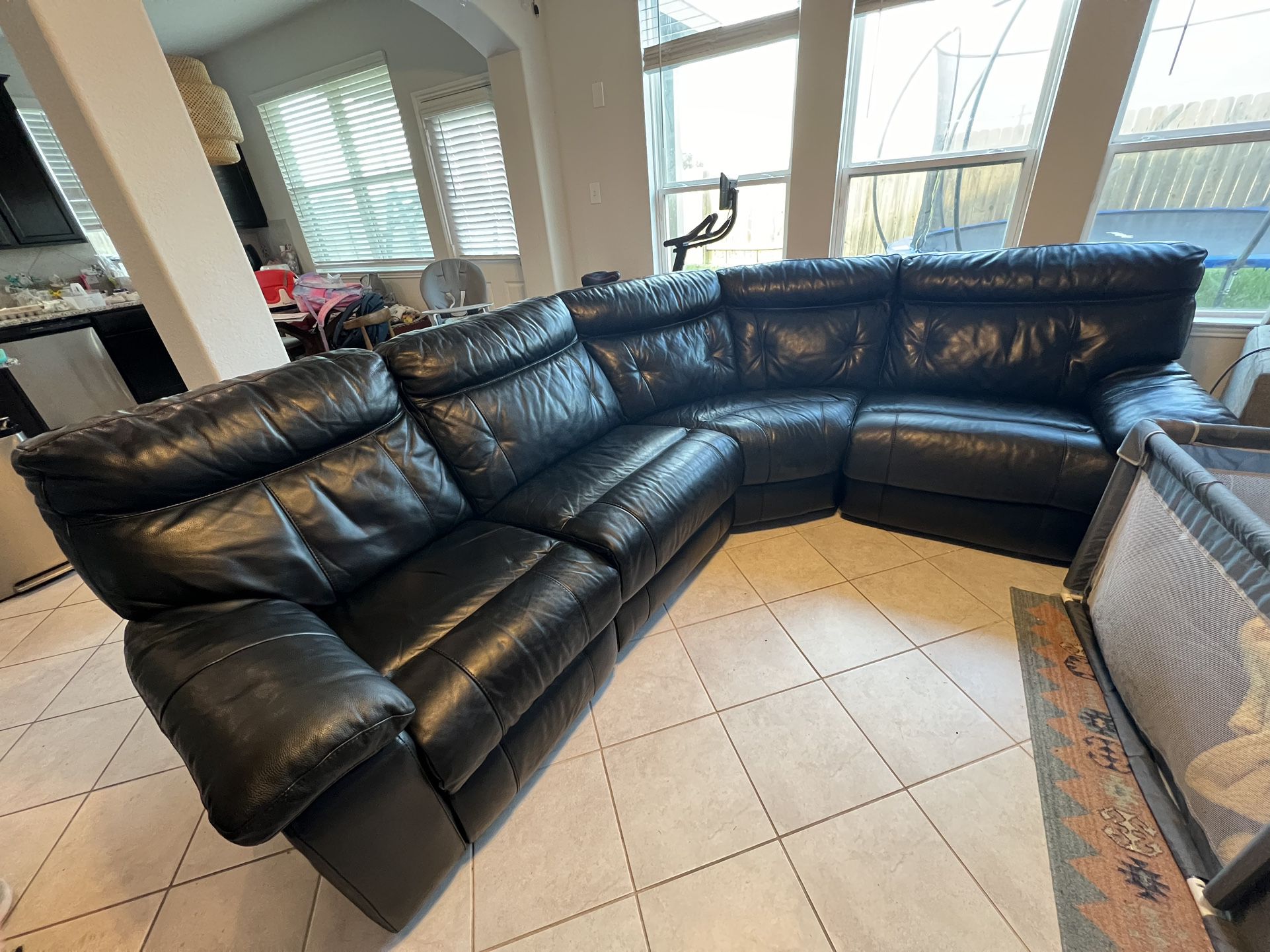 Black leather couch. Electric/custom built