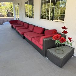 Patio Lounge Set Up With Red Cushions