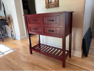 Four drawer farmhouse wood console table in antique red finish