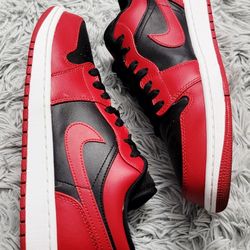 Size 10 Nike Air Jordan 1 Low Reverse Bred Gym red black 553558-606.
