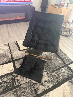 Beautiful black folding chair with foot rest