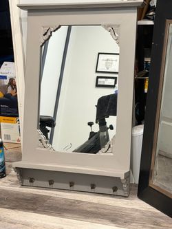 Mirror with hooks