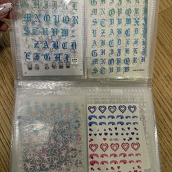 More than 80 nail art stickers and a nail sticker storage album.