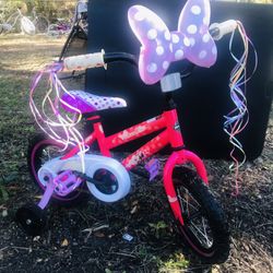 Huffy Minnie mouse bicycle with training wheels Practically new 12.5 inches with Minnie mouse helmet