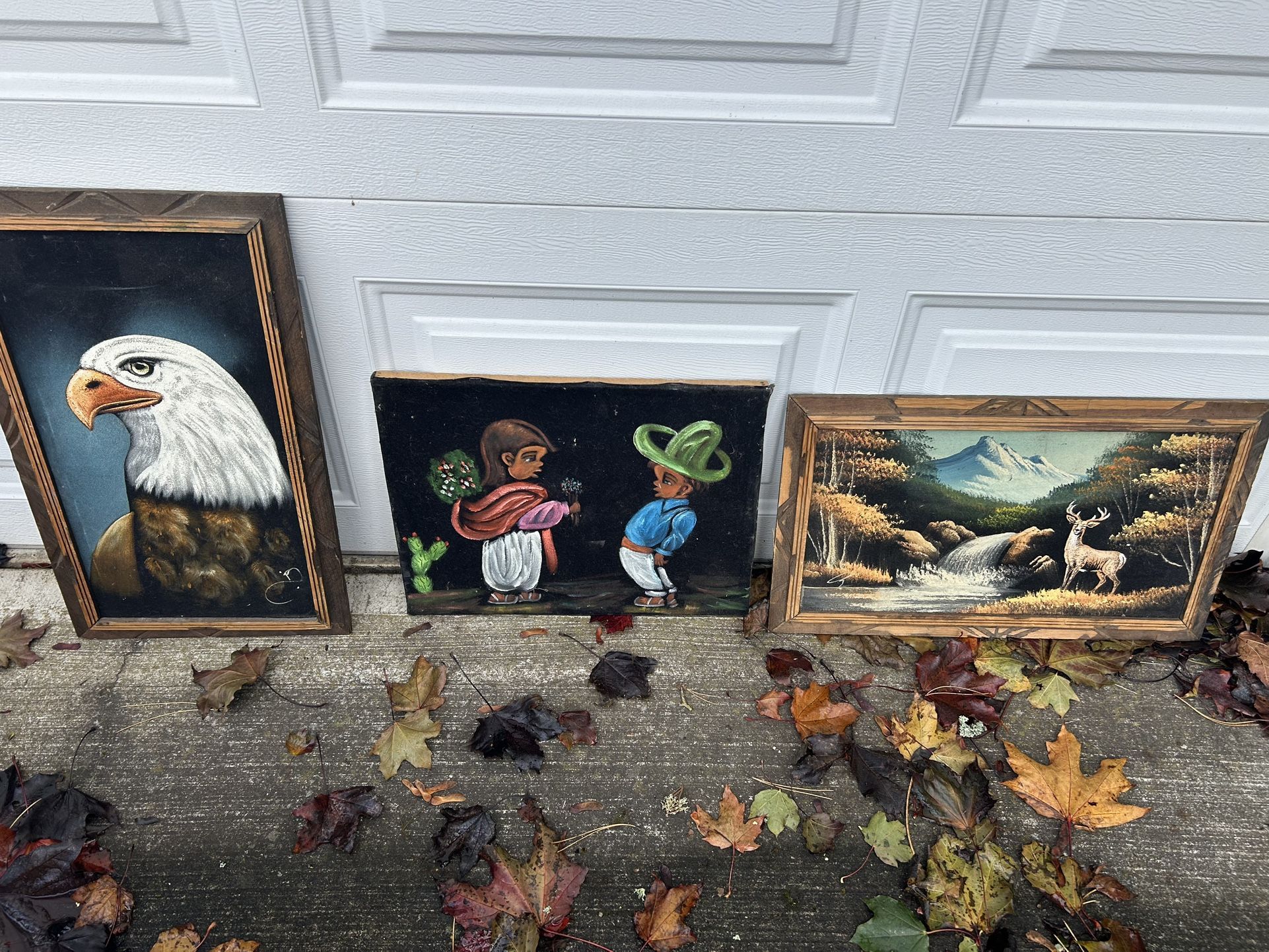 Three Vintage velvet paintings, an eagle, a deer in a meadow and two Hispanic looking children. All of them in good shape, two of them are framed
