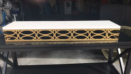 Gold and white shelf