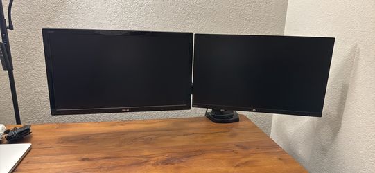 Dual 24’ monitors with swivel arms