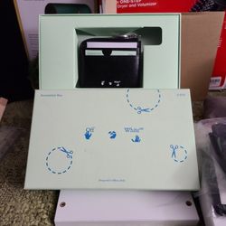 shows an Off-White Binder Diagonal Saffiano Zip Wallet 