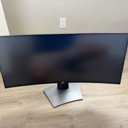 The device pictured is a Dell UltraSharp U3417W monitor, a 34-inch curved ultrawide model with WQHD (3440 x 1440) resolution, designed for productivit