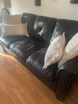 Brown leather sofa and chair