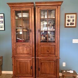 2 cabinets with glass front used as pantry space