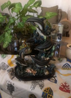 Seven Gray dolphin statue