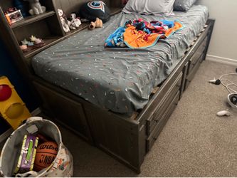 Captains bed w/ drawers and shelves( also has a mattress)