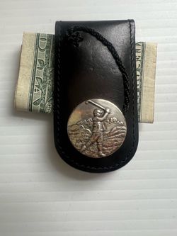 VTG Brighton black leather magnetic money clip silver-toned emblem of a golfer on a course.