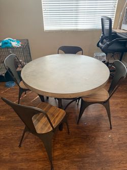 Dining room cement table with chairs