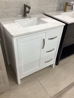 30” vanity, wood pvc, white, stone top, available for pick up