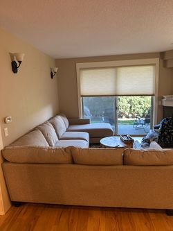 Sectional beige pillow top with ottoman