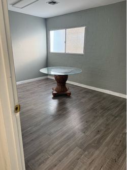 Round Glass with brown Circular Oval Pineapple Shape Leaf design and 4 wooden blocks base Table. PICKUP ONLY in GRANADA HILLS AREA by Monday July 6th