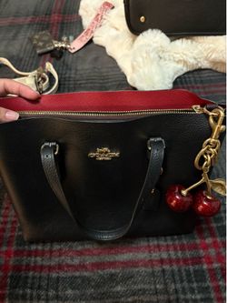 Black coach tote with cherries