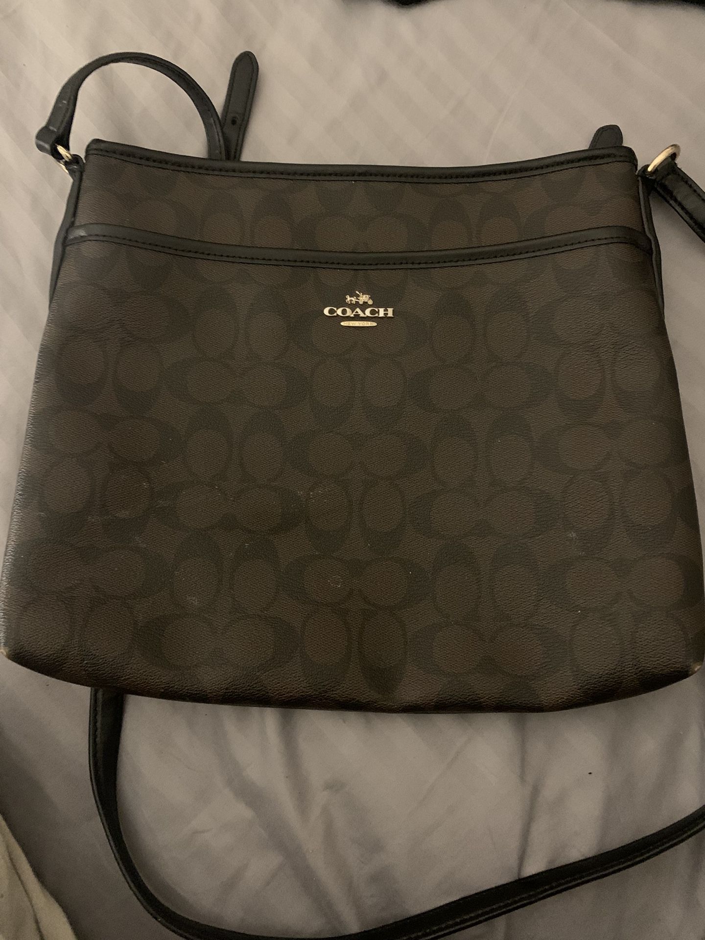 Brown and black coach crossbody bag